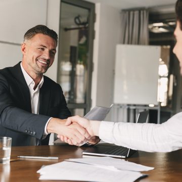 Business, career and placement concept - joyful handsome busines Impulsa tu futuro: Nueva plataforma que acompañará a los peruanos en el camino a la reinserción laboral