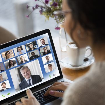 Young Woman Attending Video Conference on laptop computer Más de 6800 socios fortalecerán su negocio con Schneider Electric en 2021
